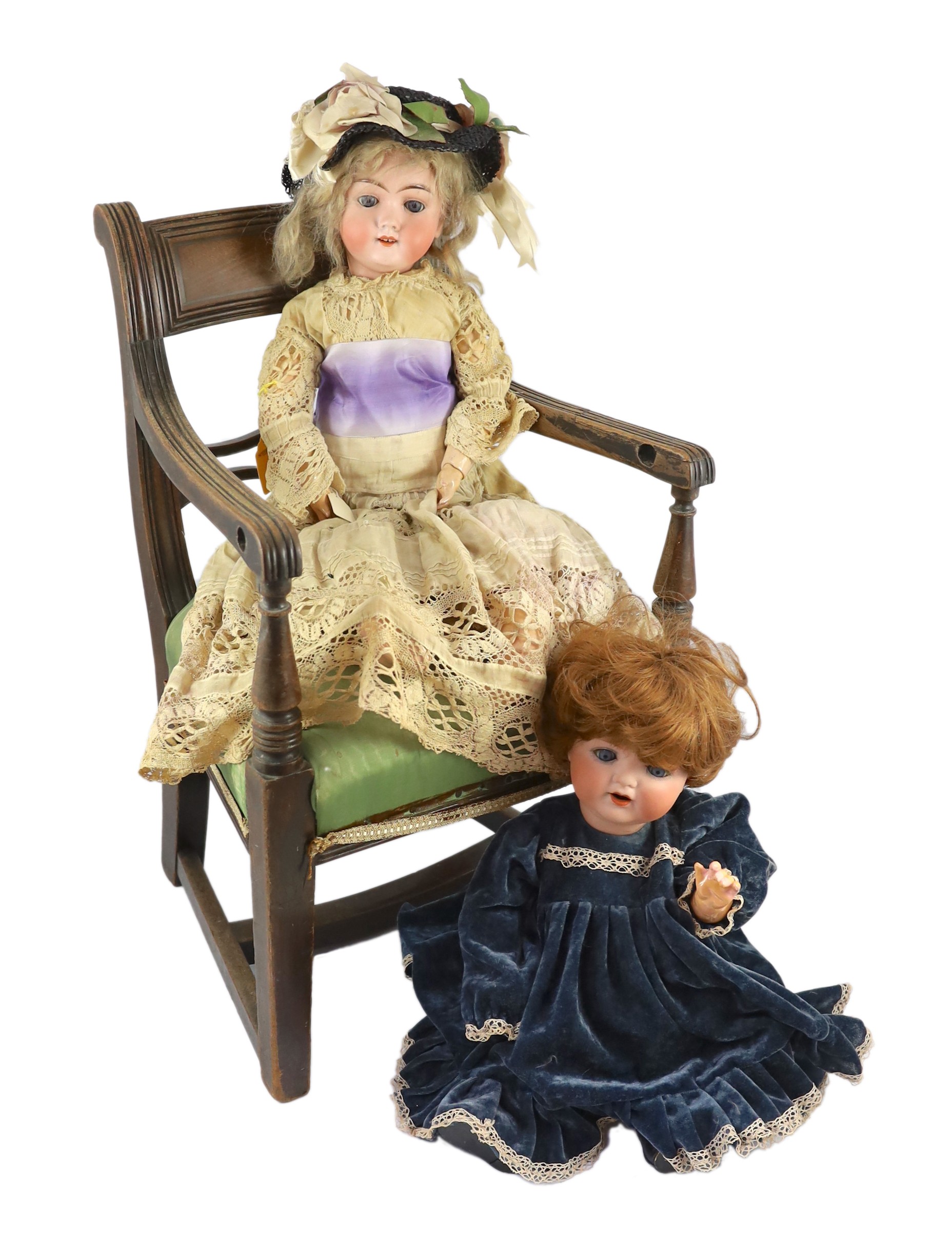 An Armand Marseille bisque doll, German, circa 1935, 21in. (2) Please note the chair is for display purposes only.